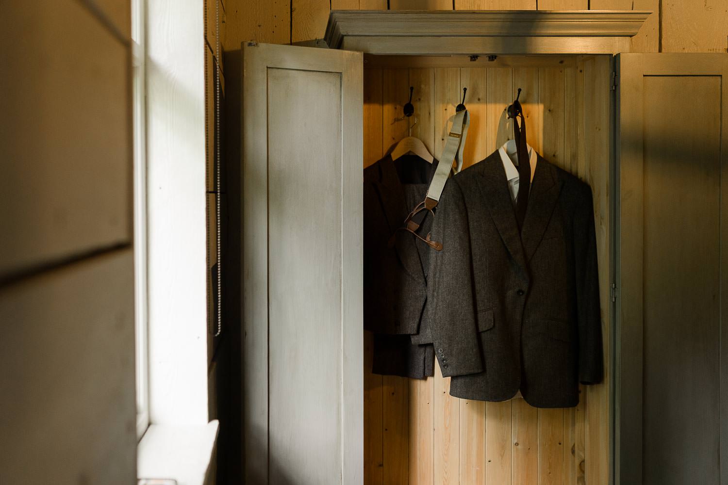 Groom's suit on hanger at Babington House.