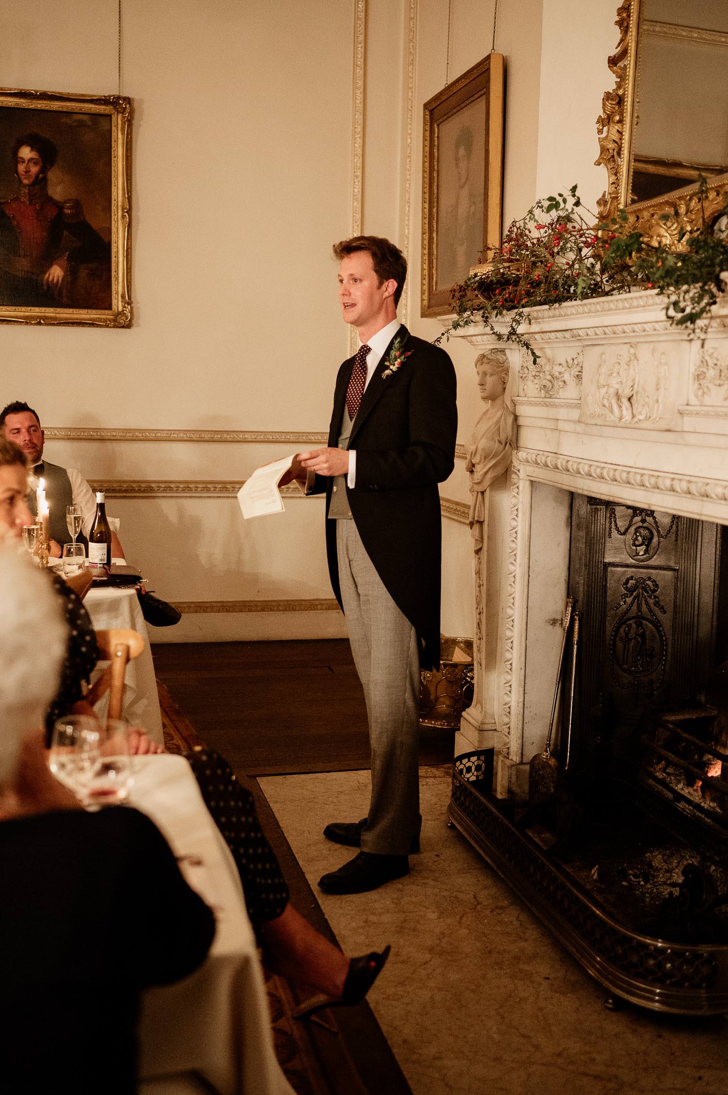 Groo standing in front of the fireplace at Came House. 