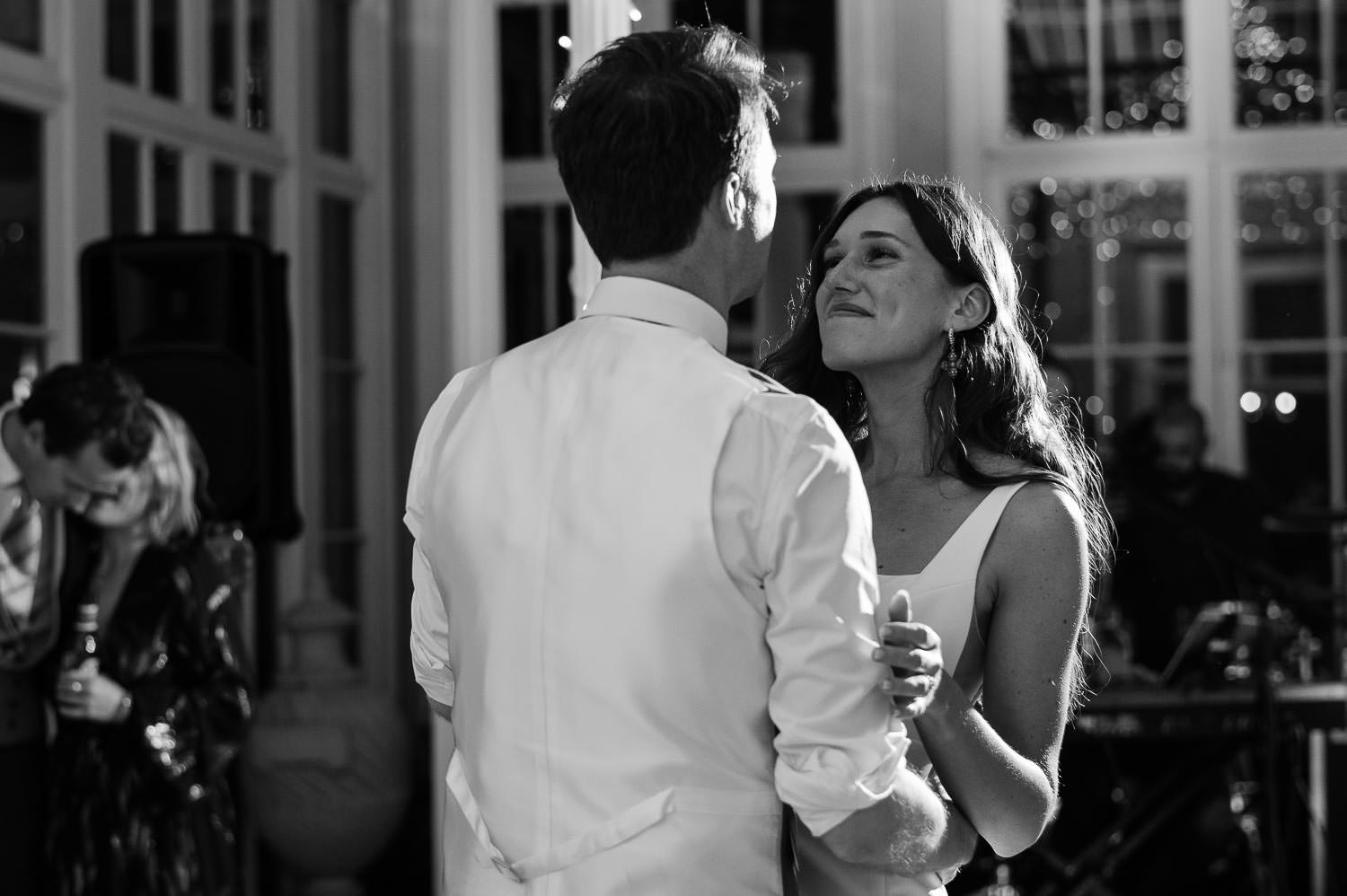 The bride lovingly looking at the groom during their first dance.